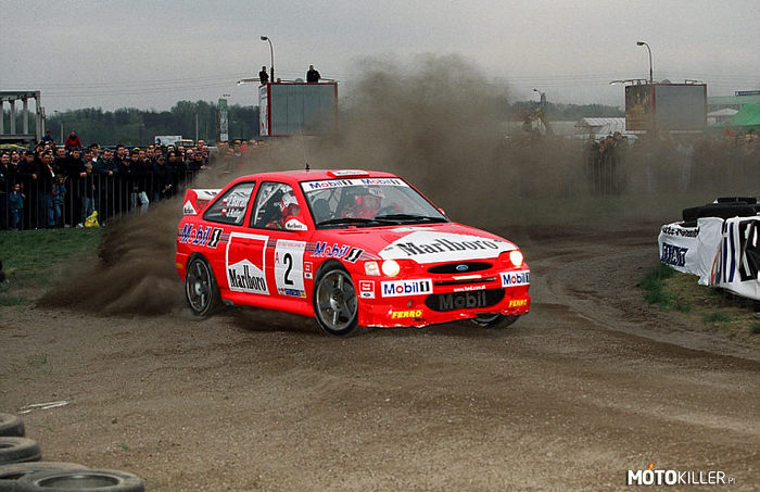 Ś.P.  Janusz Kulig i Ford Escort WRC –  
